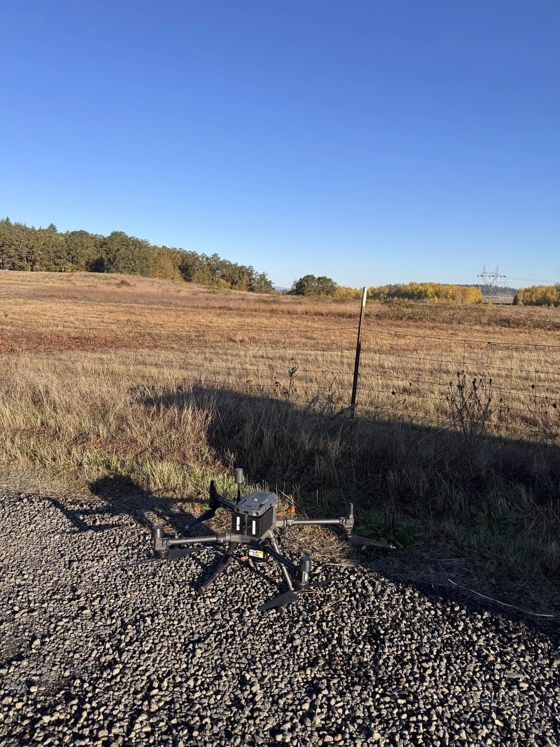 The Matrice 300 with the RESEPI LiDAR on the ground in a Eugene field between flights.