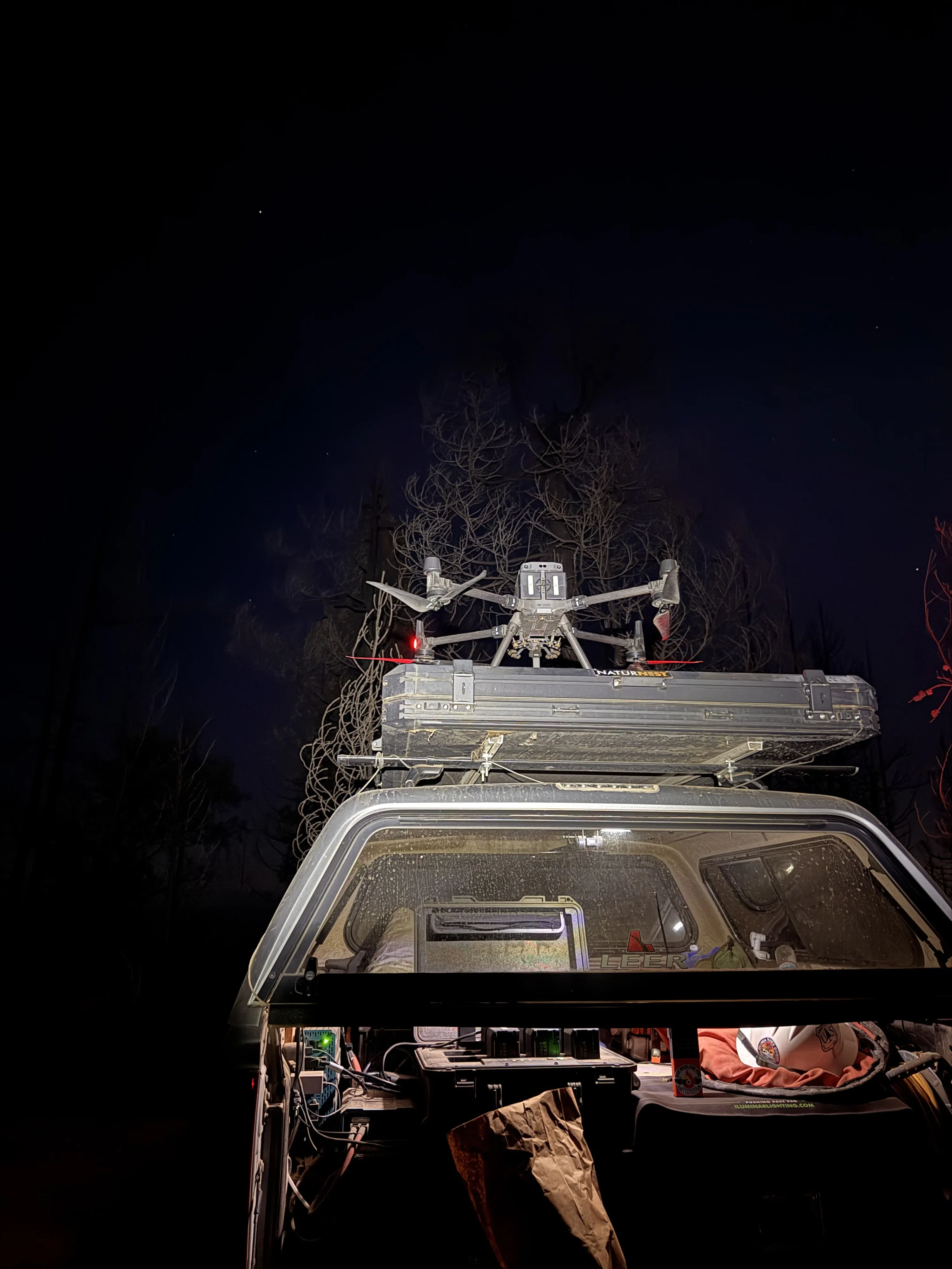 The aircraft launching from the rooftop tent at night.