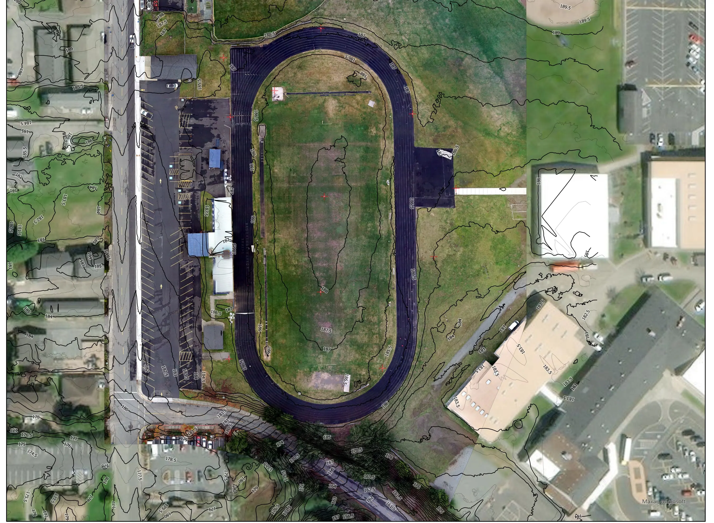 Contours drawn over the orthomosaic of the track, field, and surrounding buildings.